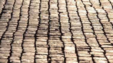Güneş ışığında asfalt kapanıyor. sokak taşının arkaplan dokusu