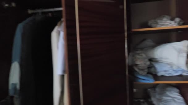 Poignant Image Depicts Closet Filled Personal Belongings Including Clothes Broken — Stock Video