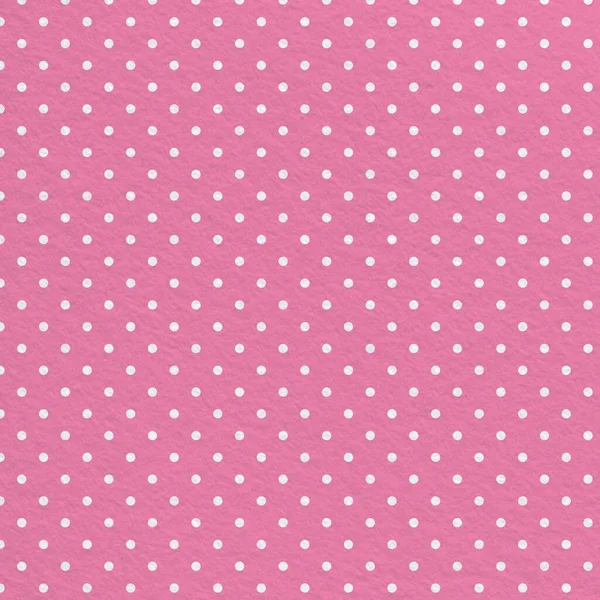 Vivid pink polka dot seamless pattern with vintage paper texture