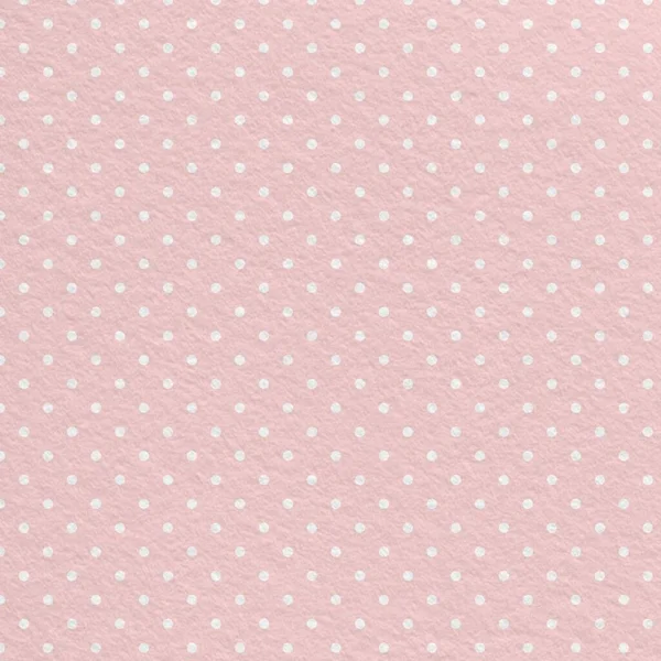 Pastel pink polka dot seamless pattern with vintage paper texture