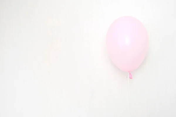 Stock image A bundle of pink and transparent air balloons with silver confetti, copy space for your text, tender pastel colors for a girlish party