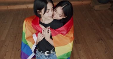 Pride Event, friendship concept. Romance and portrait of lesbian couple enjoying. LGBT rights, Lesbian family. Two women sharing love and support holding hands. Lifestyle and relationships.