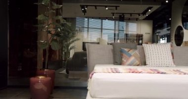 Elegance interior design. Minimalist Bedroom. Modern Bedroom Interior and bed with many pillows. Real Estate. Interior of modern luxury bedroom with furniture.