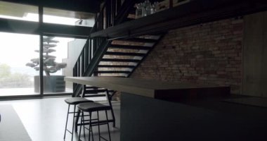 Luxury kitchen with an island. Modern interior in luxury house. Modern Chrome Faucet. Minimalist design in New Home. Real Luxury Design Interior. Neoclassic Style, cozy interior.