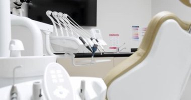Modern Room with dental chair and medical equipment. Concept of dental care. Modern dental practice. Dental clinic equipment.