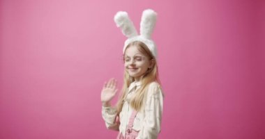 Collage from many footage for Happy Easter Concept. Little playful girl with bunny ears play with Little Bunnies on colorful isolated background. Happy Easter day. Happy family Easter