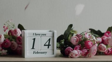Calendar with the date February 14 and the inscription I love you, with pink rose flowers and many hearts. Happy Valentines Day. 14 February Valentines Day idea.