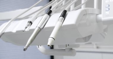 Modern Room with dental chair and medical equipment. Modern dental practice. Dental chair and other accessories. Dental clinic equipment.