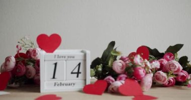 Calendar with the date February 14 and the inscription I love you, with pink rose flowers and many hearts. Happy Valentines Day. 14 February Valentines Day idea.