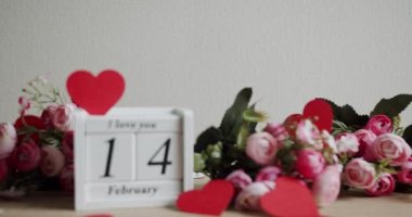Calendar with the date February 14 and the inscription I love you, with pink rose flowers and many hearts. Happy Valentines Day. 14 February Valentines Day idea.