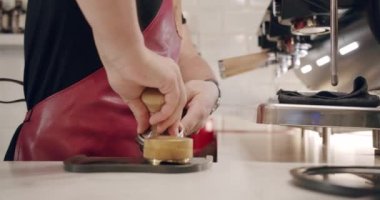 Barista making coffee with espresso machine. small independent cafe business. Barista making coffee. The process of milk churning. Flowing fresh ground coffee. Drinking roasted black coffee.