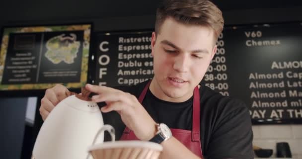 Male Barista Apron Filling Water Kettle Cup Barista Making Latte — Vídeo de Stock
