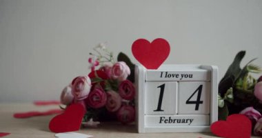 Calendar with the date February 14 and the inscription I love you, with pink rose flowers and many hearts. Happy Valentines Day. 14 February Valentines Day idea.