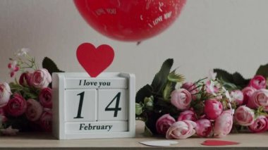 Calendar with the date February 14 and the inscription I love you, with pink rose flowers and many hearts. Happy Valentines Day. 14 February Valentines Day idea.
