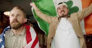 Loyal football fans supporting their team. Happy mixed race supporters cheering and exulting after winning. football, hockey, basketball, sports games.