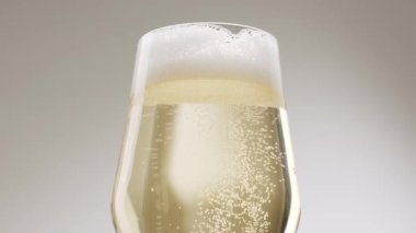 Glass of champagne on white isolated background. Champagne bubbles. Slow motion and super macro shot of tiny air bubbles flowing upwards in elegant glass of champagne on a white background