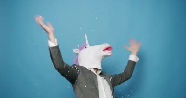 Man Unicorn Mask Making Funny Gestures Business Man Unicorn Mask – Stock-video