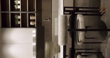 Bir adası olan lüks bir mutfak. Lüks evde modern iç mekan. Modern Krom Musluk. Yeni Ev 'de minimalist tasarım. Gerçek Lüks Tasarım İçi. Neo-klasik tarz, samimi bir iç mekan. Dikey video.