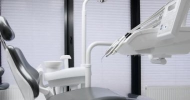 Modern Room with dental chair and medical equipment. Modern Dental office. Dental equipment at dental office. 