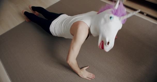 Funny Man Unicorn Mask Doing Push Exercise Home Comical Fitness — Stock Video