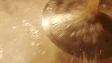 Inside the brewing boil tank. Beer production. Cooked malt barley for craft beer. making in craft brewery, top view kettle with beer inside, flowing beer.