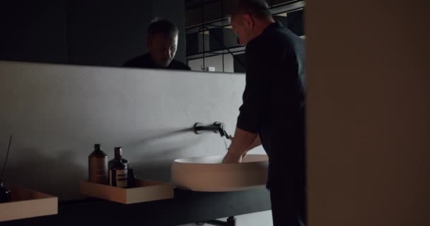 Man Washes His Hands Luxury Bathroom Interior Black Gray White — Stock Video