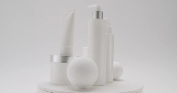White Bottles Tubes Rotate Cosmetics White Background Studio Cosmetics Oils — Stock Video
