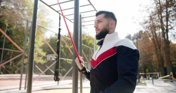 Trainer Male Correcting Fit Does Gym Exercises Rubber Band Outdoor — Αρχείο Βίντεο