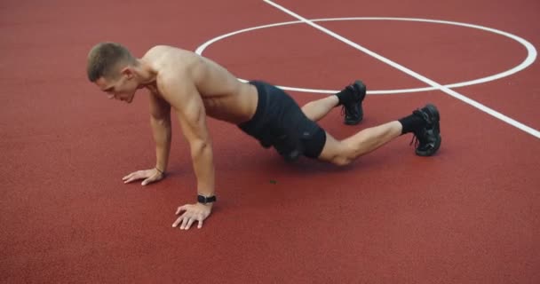 Athletic Man Has Workout Outdoors Doing Burpees Exercise Jump Push — Stock Video