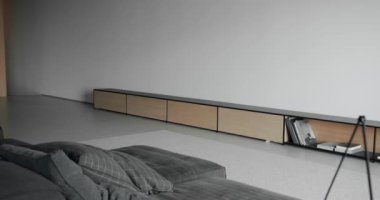 Beyaz duvarı ve siyah mobilyası olan modern Minimalist oturma odası. Köşedeki kanepe ve kitaplığı olan lüks modern ev iç mimarisi. Moda mobilya. Minimalist Ev İçi. Zarif Oda.