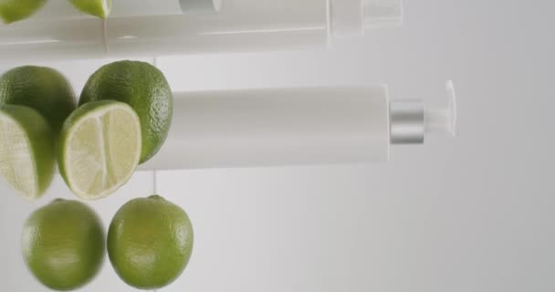 White Bottle Tubes Lime Fruits Cosmetics White Background Studio Natural — Stock Video
