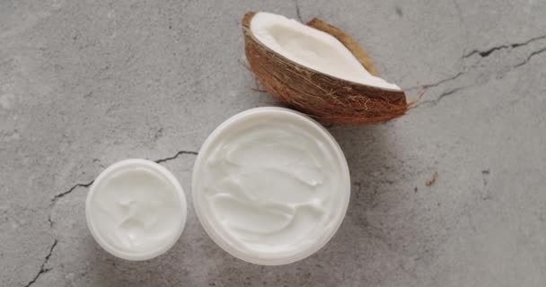 White Jars Tubes Coconut Cosmetics Rotate Gray Concrete Background Studio — Stock Video