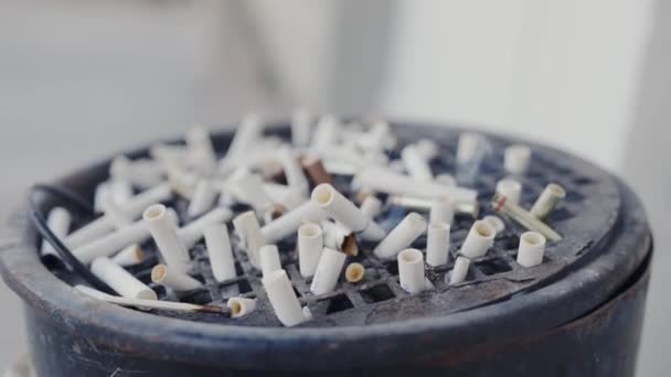 Close Shot Cigarrette Butts Smoldering Cigarette Butts Large Metal Ashtray — Stock Video