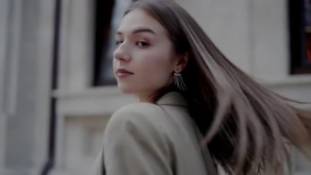Atmospheric Portrait Young Woman Serene Expression Standing Urban Street Dusk — Stock Video