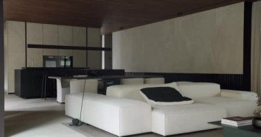 Gösterişli mobilyalar ve doğal ahşap aksanlı minimalist bir tasarımın yer aldığı çağdaş bir oturma odası. İnce ama sofistike ayar bir lüks hissi yakalıyor. Zarif Modern Oturma Odası