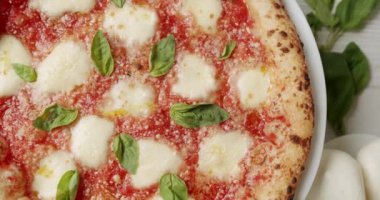 Margherita Pizza Topped with Melted Mozzarella Cheese. Fresh Delicious Food. Organic Cuisine. Restaurant Pizza Food. Pizza Margherita. Italian cuisine. Neapolitan Margherita Pizza.