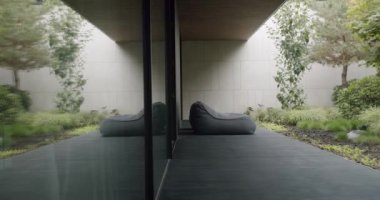 Explore tranquility and modern design in this image featuring a sleek home interior with a serene garden view. Perfect for those seeking inspiration for modern living spaces. Terrace modern house