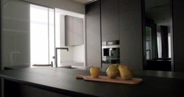 Minimalist Real Apartment. Modern Kitchen Room. Minimalist Furniture with Dining table with modern chairs. Modern Chrome Faucet. New Home. Real Luxury Design Interior. Neoclassic Style, cozy interior.