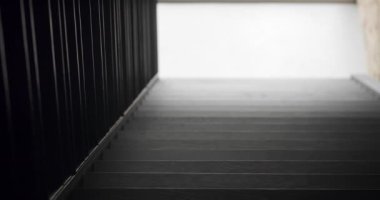Modern apartment with black stair, dolly camera movement. Modern interior of loft apartment. wooden black stairs. Modern contemporary Minimalist living room