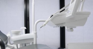 Modern Room with dental chair and medical equipment. Modern dental practice. Dental chair and other accessories. Dental clinic equipment.