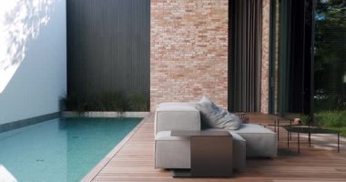 Rahat bir şezlonga, zarif mobilyalara ve büyük sürgülü kapılara ve yemyeşil bahçelere sahip tuğladan bir duvarın yanında dingin bir havuza sahip açık hava rahatlama alanı. Modern Ev Harici