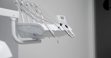 Modern Room with dental chair and medical equipment. Modern Dental office. Dental equipment at dental office and chair and other accessories.