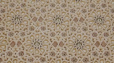 Karmaşık Fas fayans çalışmaları tekrarlanan bir desen büyüleyici bir görüntü yaratır. Geometrik tasarım, İslami sanat ve mimarinin güzelliğini gözler önüne seren yıldız ve elmas şekillerine sahiptir..