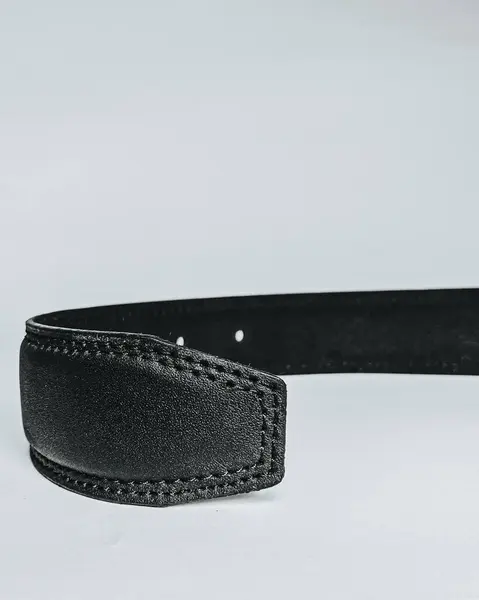 men\'s black leather belt, This high-resolution photo features a mens black leather belt, a staple accessory in any wardrobe. Crafted with precision, the belt showcases premium quality