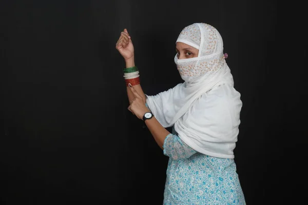 A Young Indian Woman With An Inked Finger, Casting Her Vote, Shows Bangles In The Colors Of The Tricolor, Right Hand Raised