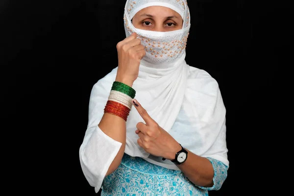 A Young Indian Woman With An Inked Finger, Shows Bangles In The Colors Of The Tricolor With Standing Hand