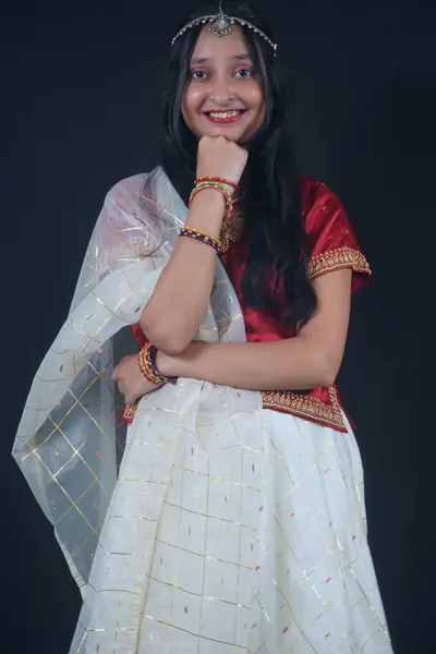 stock image Close-Up View Of Young Indian girl taking a pose in traditional Navratri attire