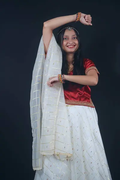 stock image Graceful Garba Dance: Young Indian Girl in Traditional Attire Celebrates Navratri with Joyful Twirls