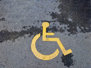 disabled parking space reserved for the disabled, painted on the asphalt in yellow color