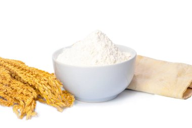 White bowl of wheat flour isolated on white background
